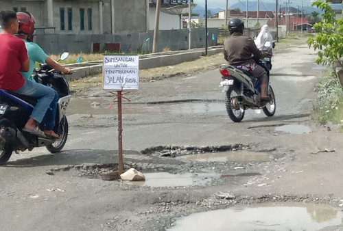  Jalan Tanjung Saung Masat Masih Rusak 